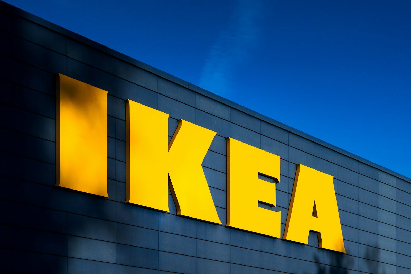 A yellow ikea sign on the side of a building