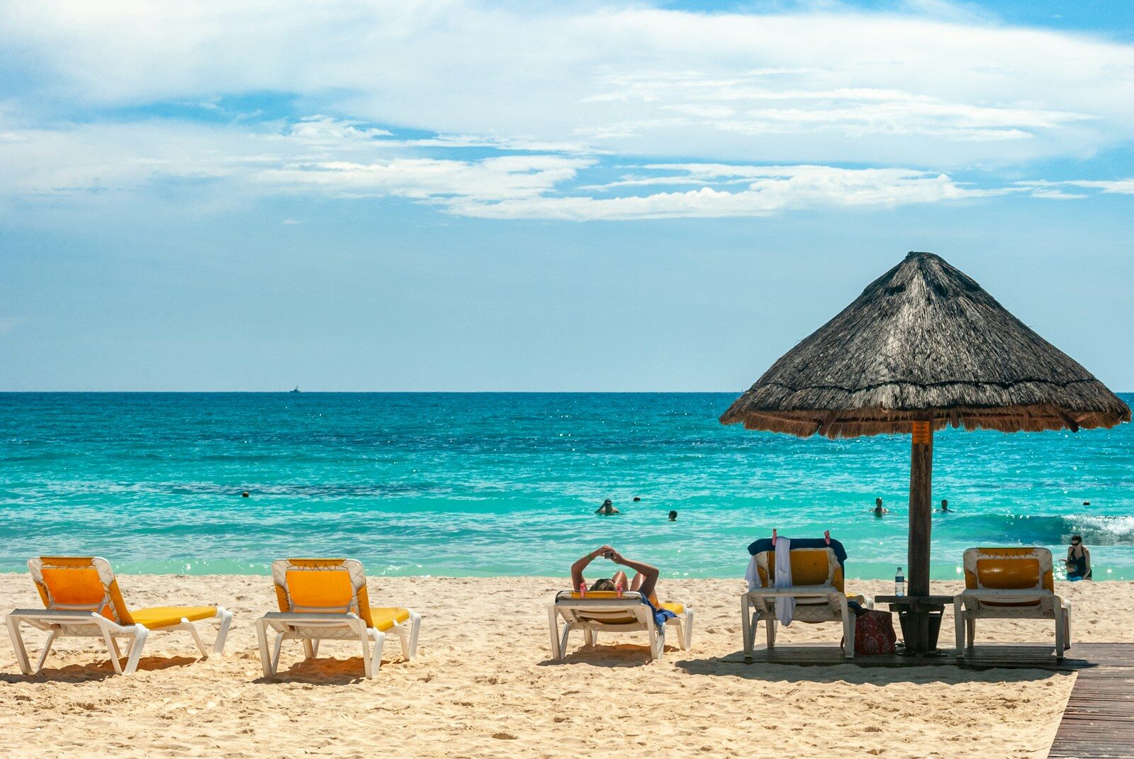 Brown beach umbrellas on beach during daytime