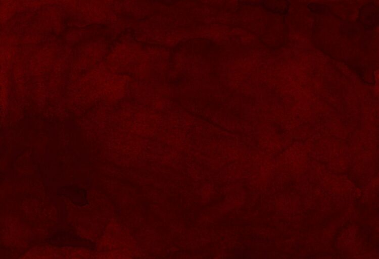 Red textile on brown wooden table