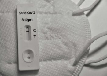 White samsung charger on white textile