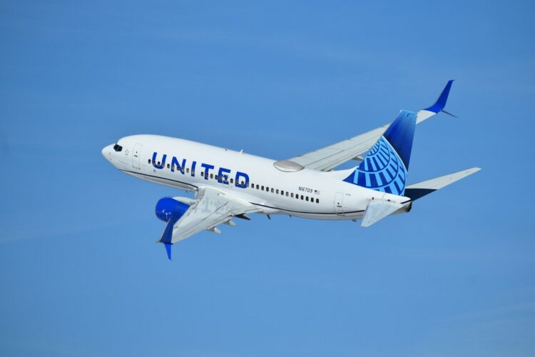 A united airlines plane flying in the sky