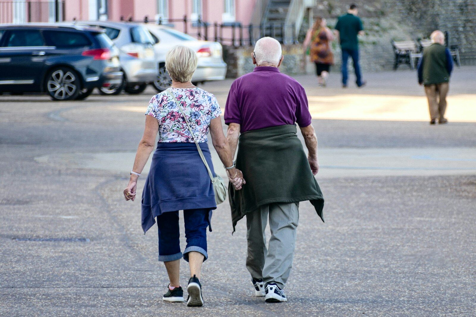 Man and woman walking on the street during daytime