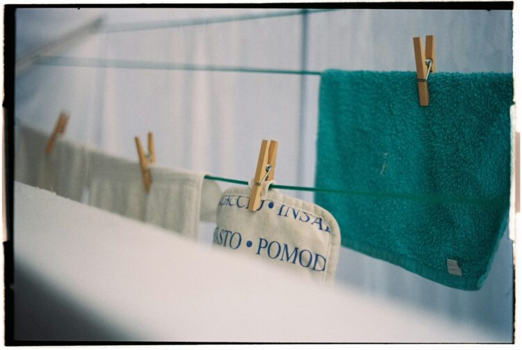 Towels hanging on a clothesline with clothespins