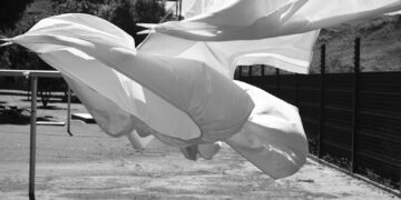 A black and white photo of a white umbrella