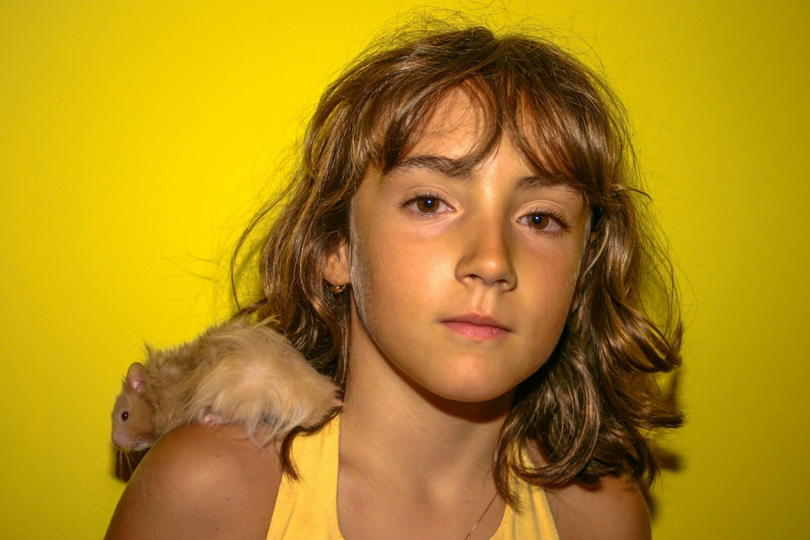 A young girl holding a stuffed animal in her arms