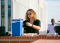 Casual rooftop barbecue scene with friends enjoying a sunny day in Portugal.