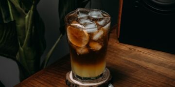 a glass of beer on a table