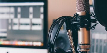 black and silver headphones on black and silver microphone