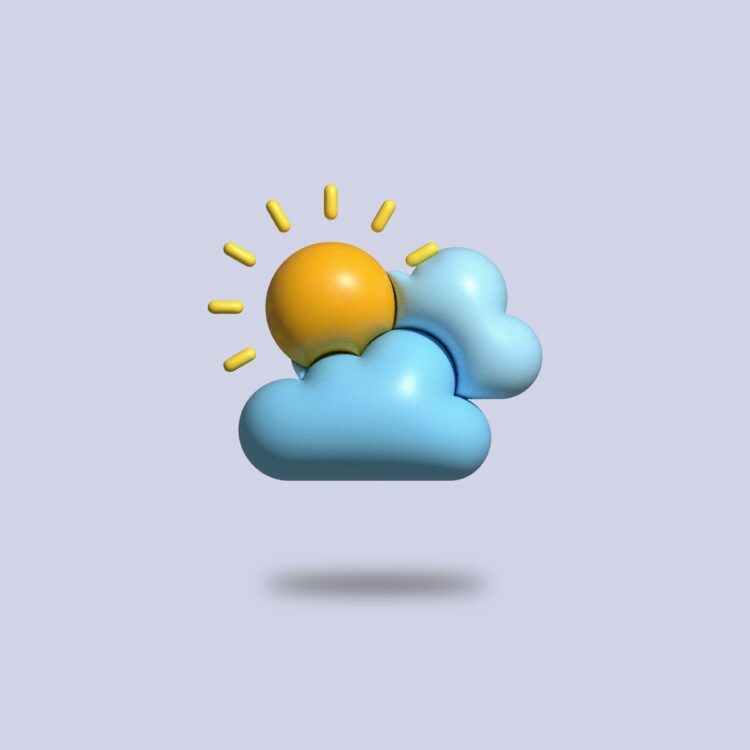 a yellow ball sitting on top of a blue cloud