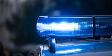 a close up of a police car with its lights on