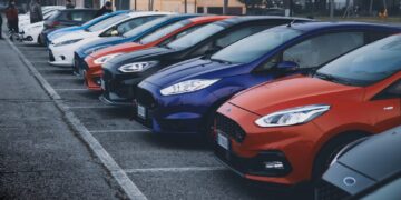 a row of cars parked in a parking lot