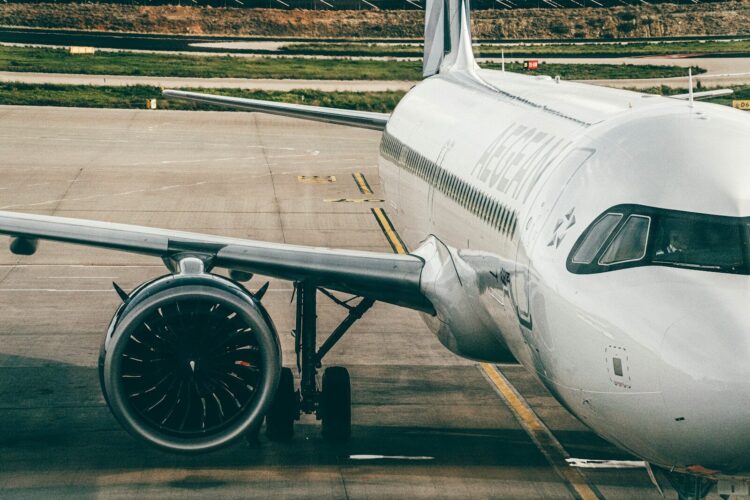 a large jetliner sitting on top of an airport tarmac