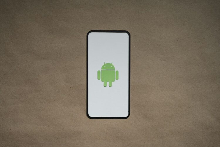 a cell phone with a green icon on it
