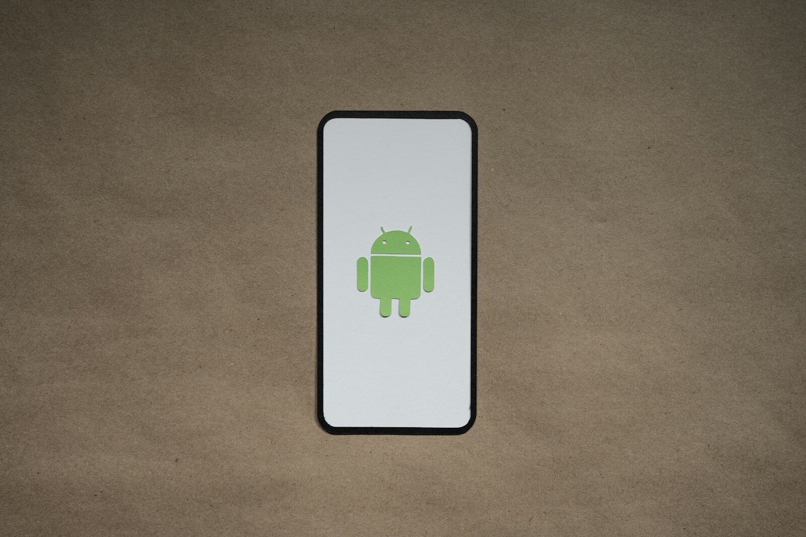 a cell phone with a green icon on it